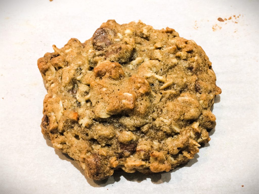 Hemp powder and oatmeal cookie on parchment paper by Crystal Smith.