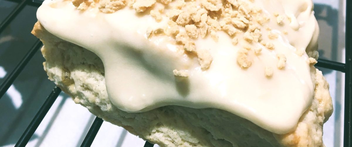 Maple scones with icing and maple flakes on top.