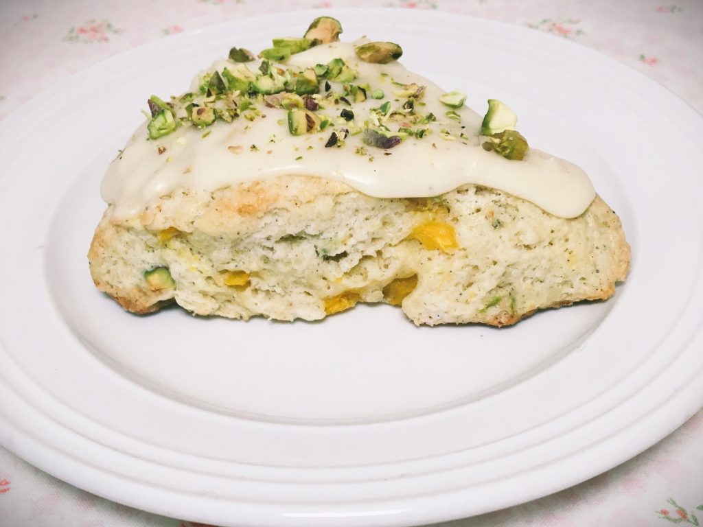Mango and pistachio scone on a white plate by Crystal Smith.