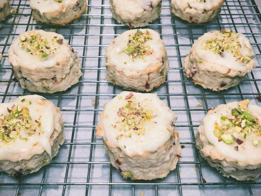 Pistachio and cranberry mini scones on a wire baking rack by Crystal Smith.